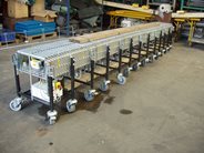 Power roller expandable conveyor